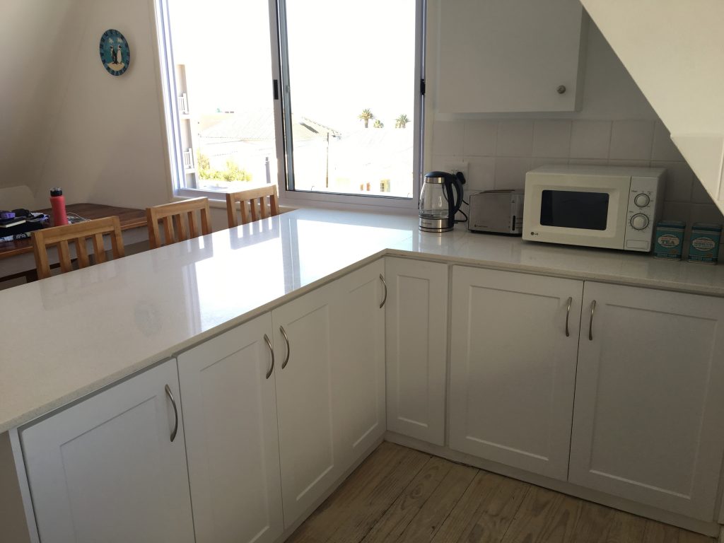 11. Open plan kitchen area wth counter and view to the beach
