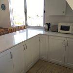11. Open plan kitchen area wth counter and view to the beach