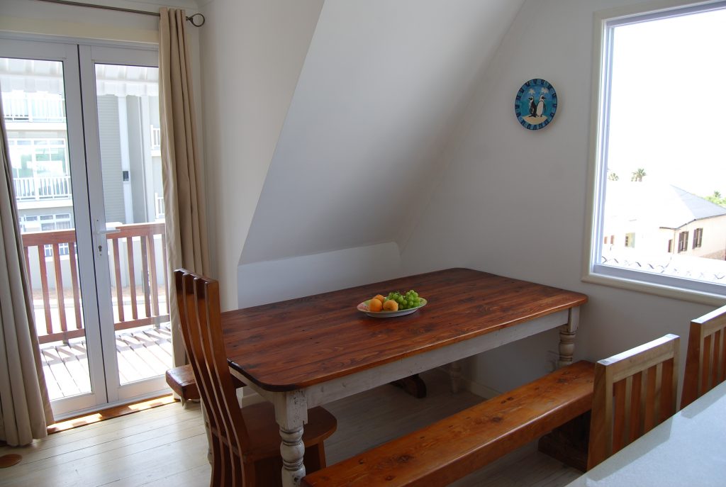 12. Open plan dining area and door leading to small balcony