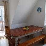 12. Open plan dining area and door leading to small balcony