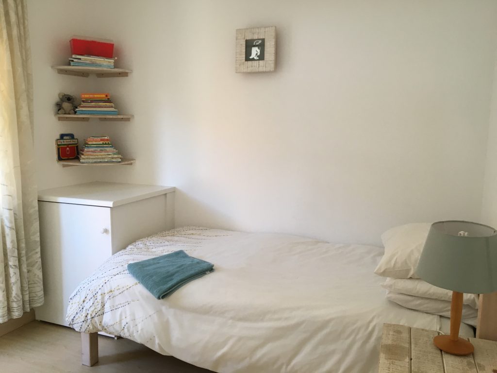6. Third bedroom with single bed and washing machine in cupboard