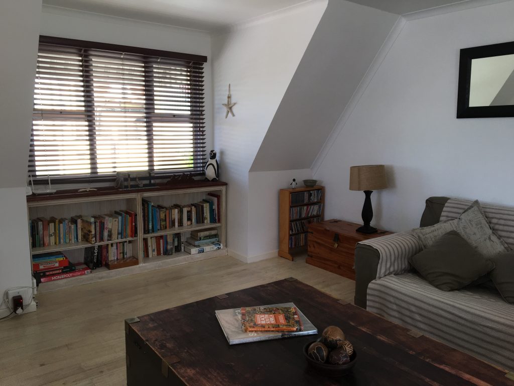 9. Upstairs living area with books, CDs and some games